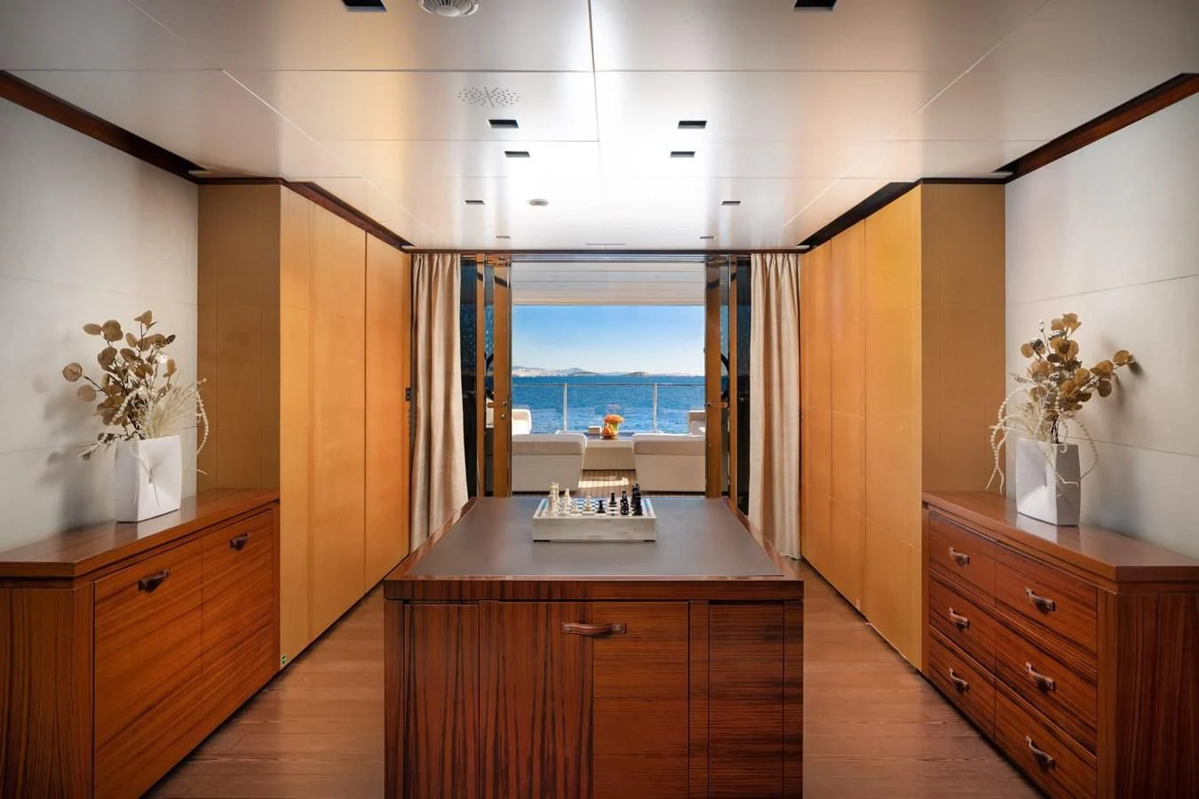 a room with a counter and cabinets aboard LAMMOUCHE Yacht for Sale