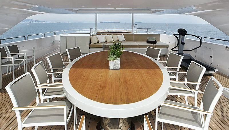 a table with chairs on it aboard LAMMOUCHE Yacht for Sale