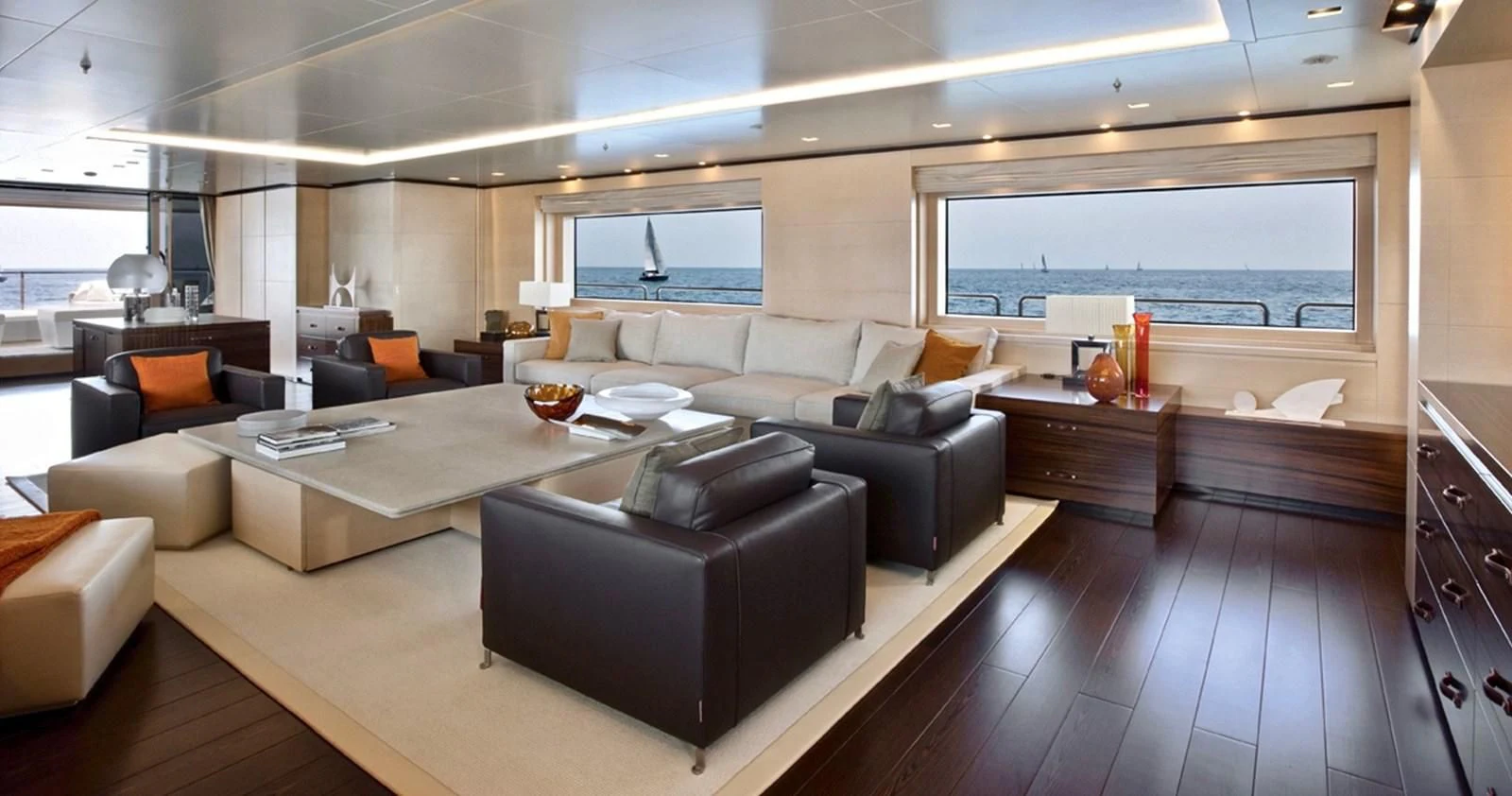 a large living room with a large window aboard LAMMOUCHE Yacht for Sale
