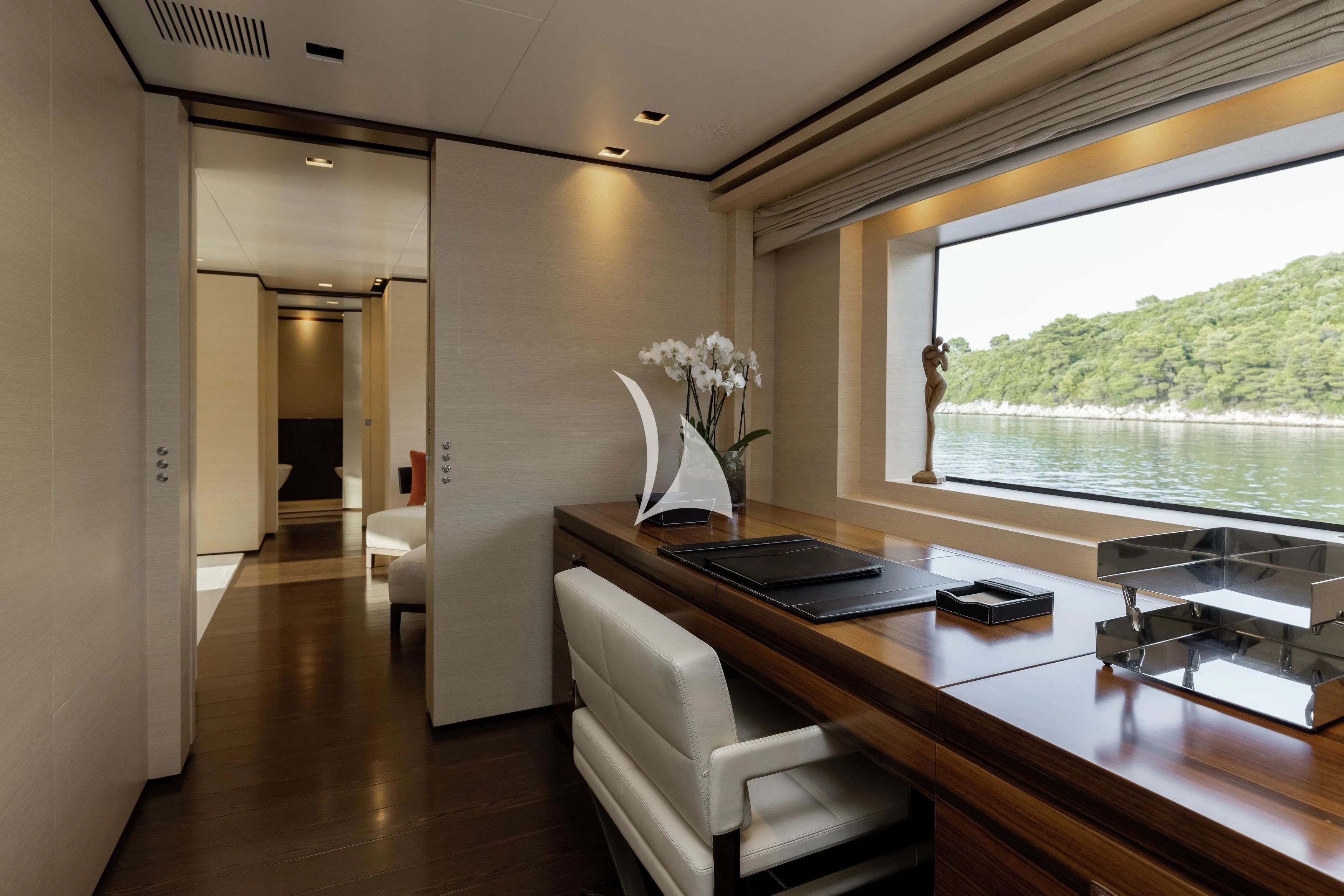 a room with a table and chairs aboard LAMMOUCHE Yacht for Sale