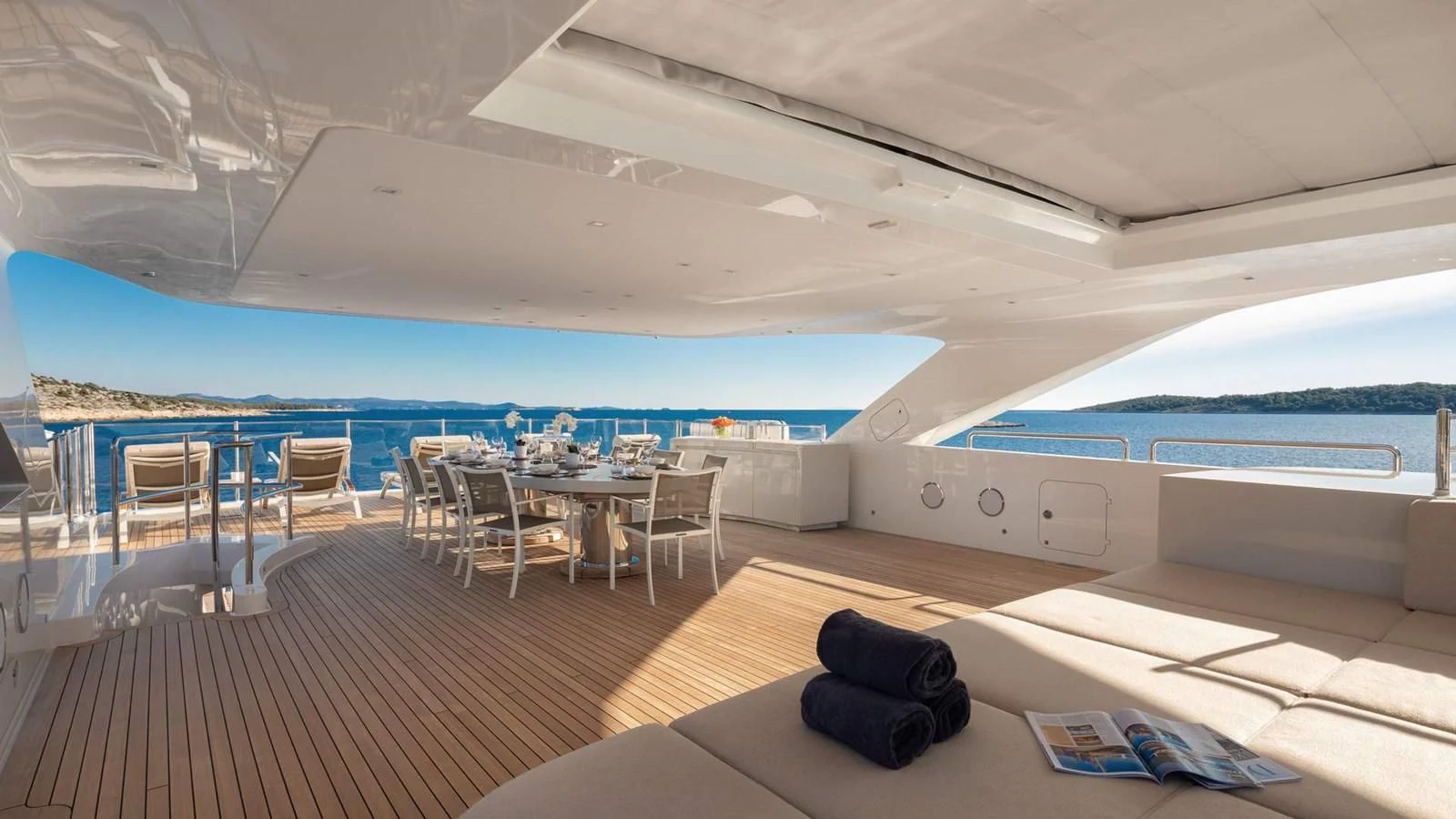 a room with a table and chairs aboard LAMMOUCHE Yacht for Sale