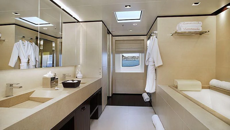 a bathroom with a large mirror aboard LAMMOUCHE Yacht for Sale