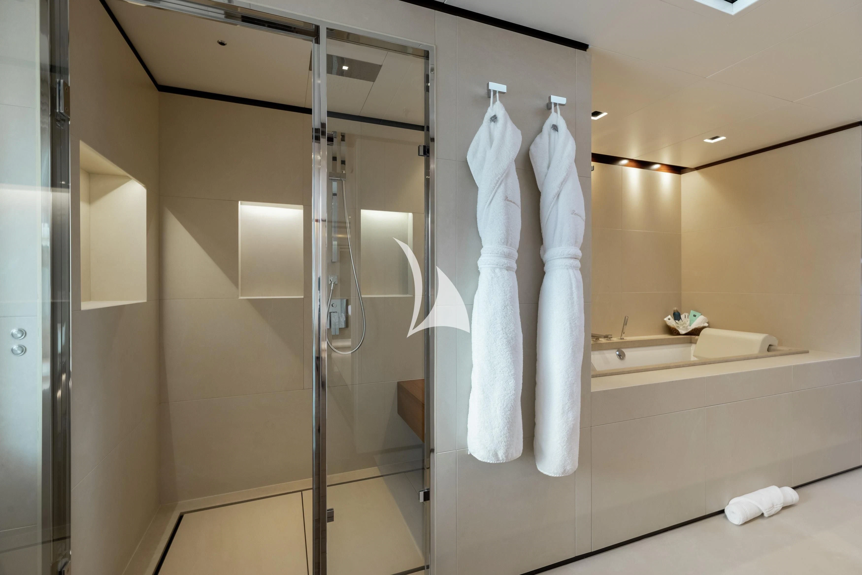 a bathroom with a glass shower aboard LAMMOUCHE Yacht for Sale