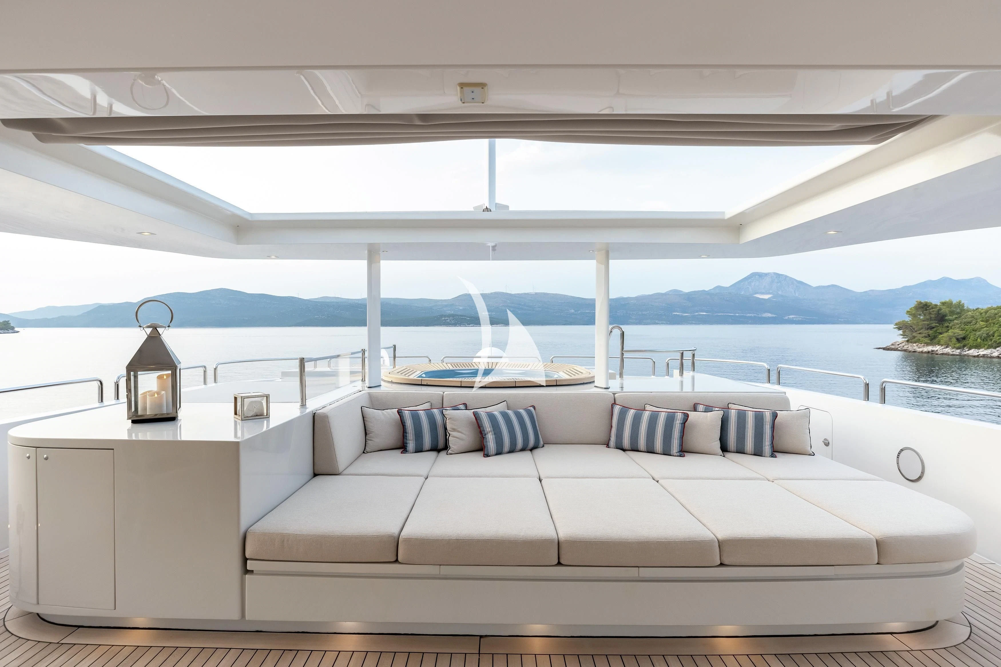 a white couch on a boat aboard LAMMOUCHE Yacht for Sale