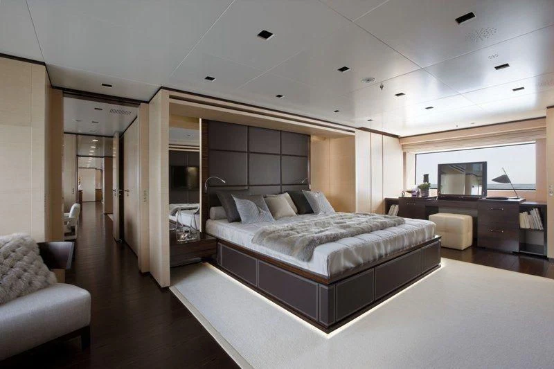 a bedroom with a large bed aboard LAMMOUCHE Yacht for Sale