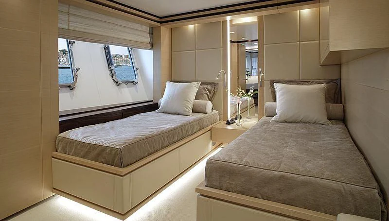 a room with two beds aboard LAMMOUCHE Yacht for Sale