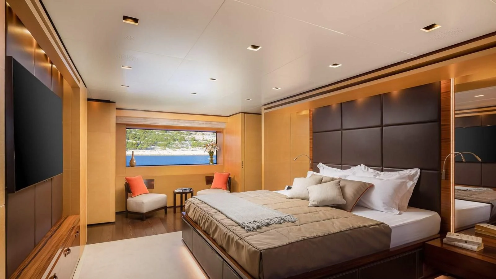 a room with a bed and a chair aboard LAMMOUCHE Yacht for Sale