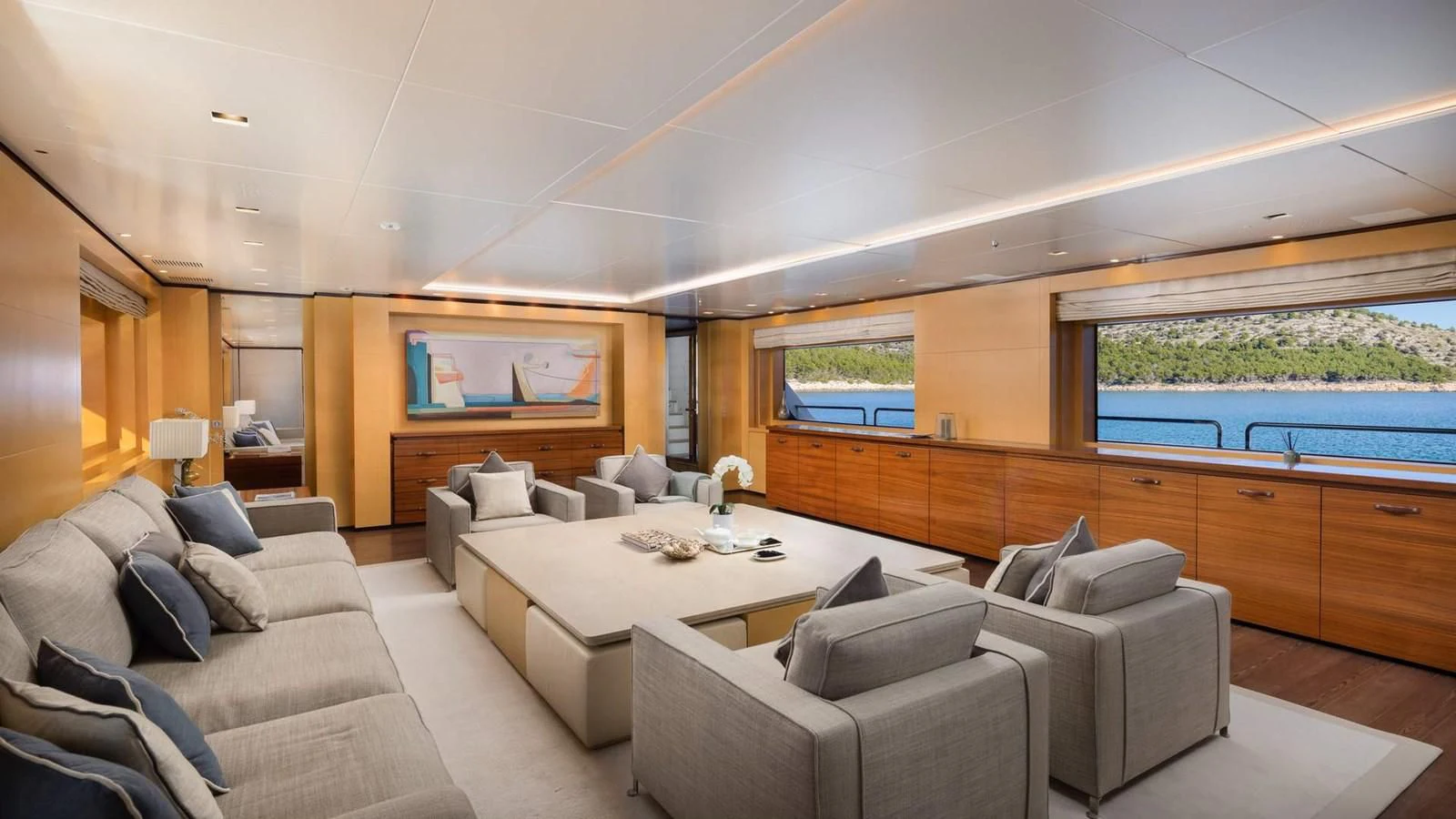 a living room with a large window aboard LAMMOUCHE Yacht for Sale