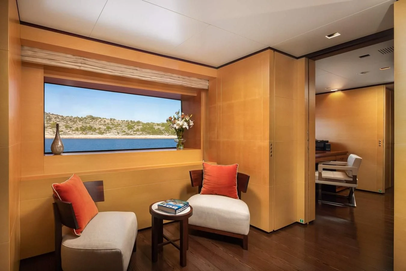 a room with a couch and a table and chairs aboard LAMMOUCHE Yacht for Sale