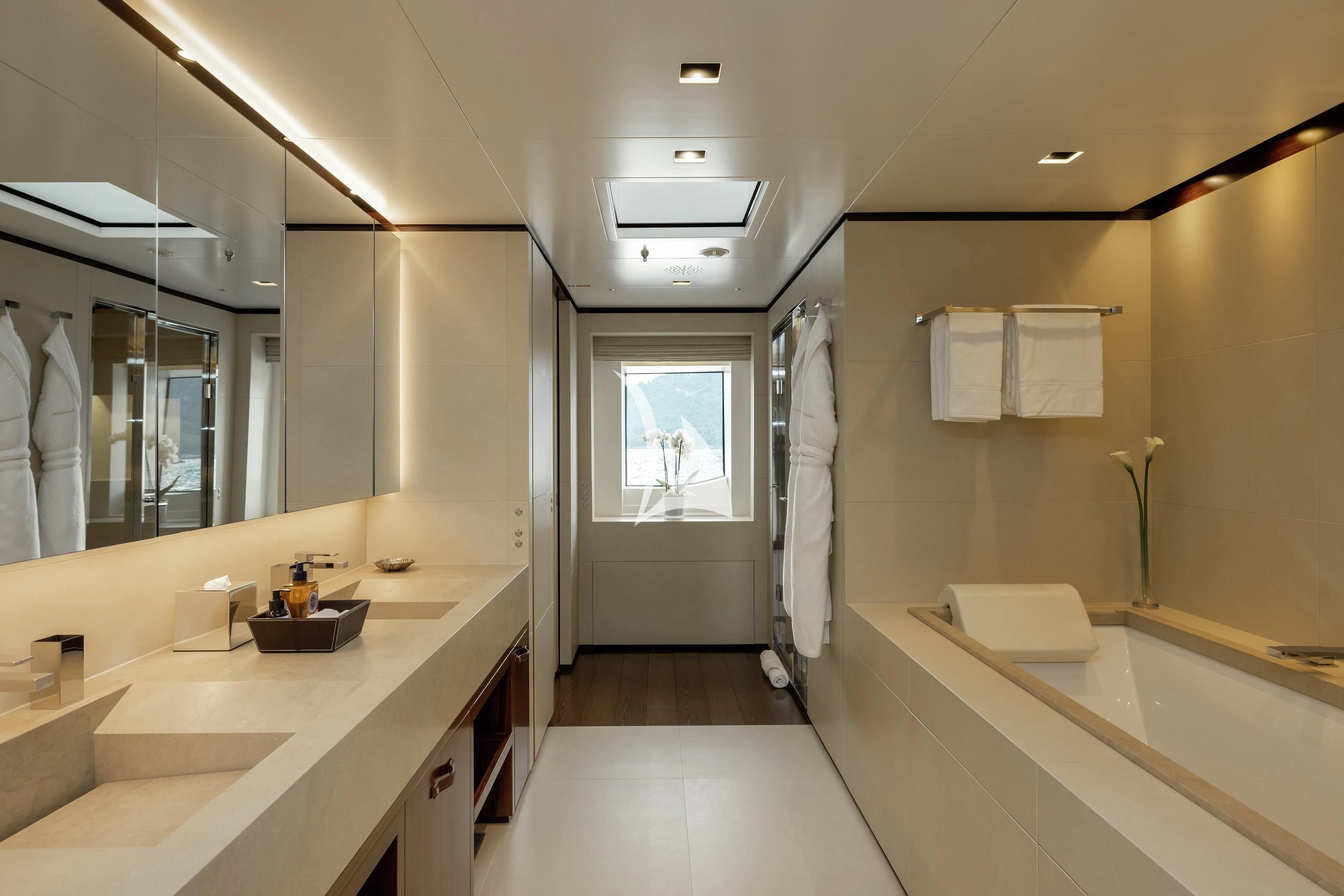 a bathroom with a large mirror aboard LAMMOUCHE Yacht for Sale