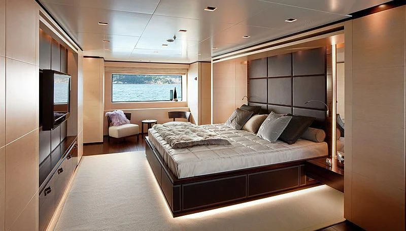 a large bedroom with a large bed aboard LAMMOUCHE Yacht for Sale