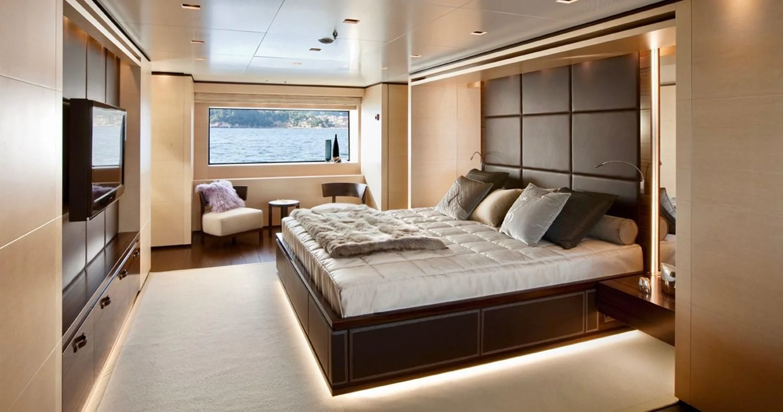 a large bed in a room aboard LAMMOUCHE Yacht for Sale