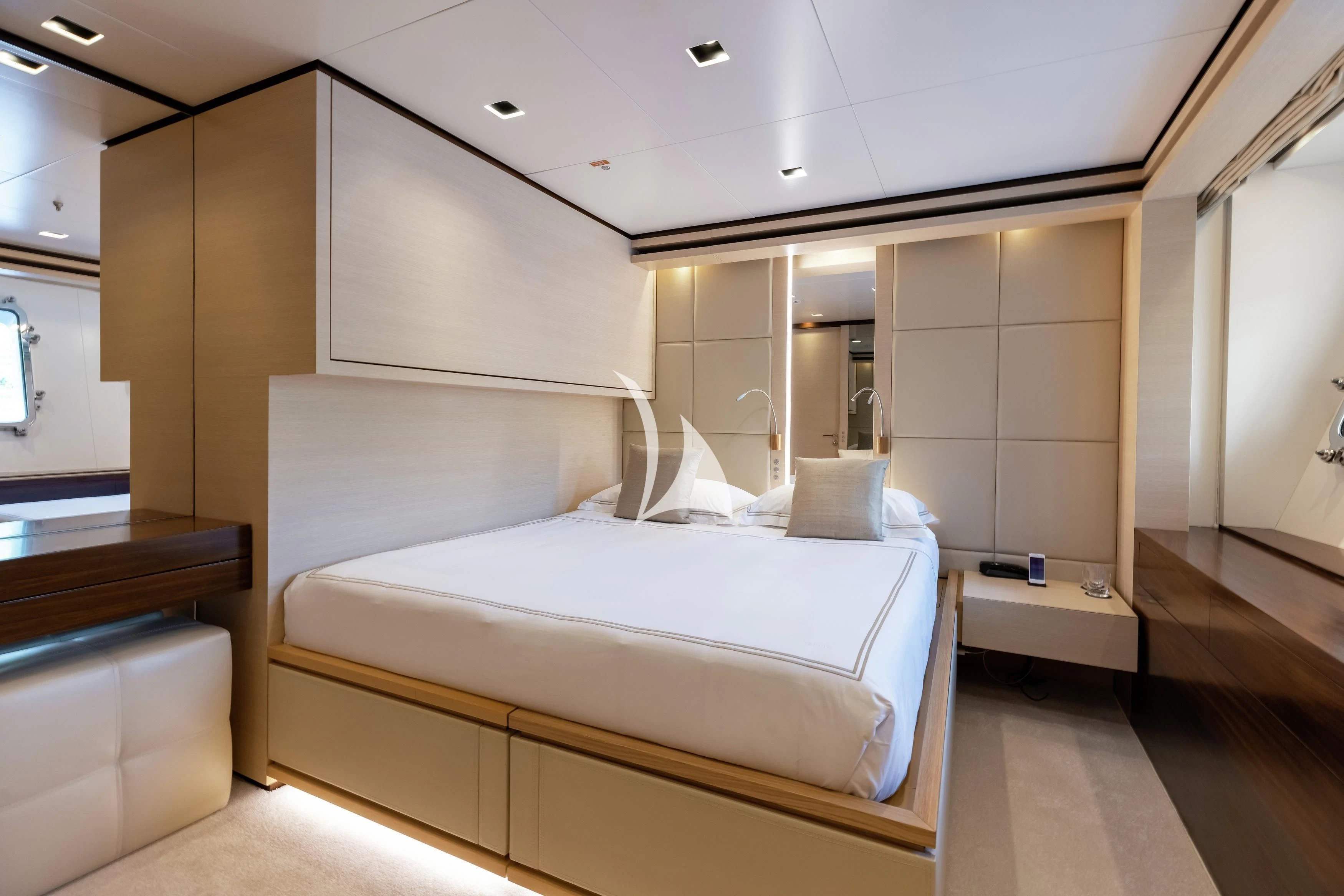 a room with a bed and a mirror aboard LAMMOUCHE Yacht for Sale