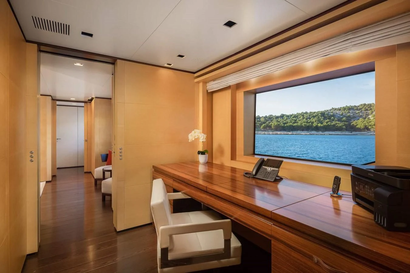 a room with a table and chairs aboard LAMMOUCHE Yacht for Sale