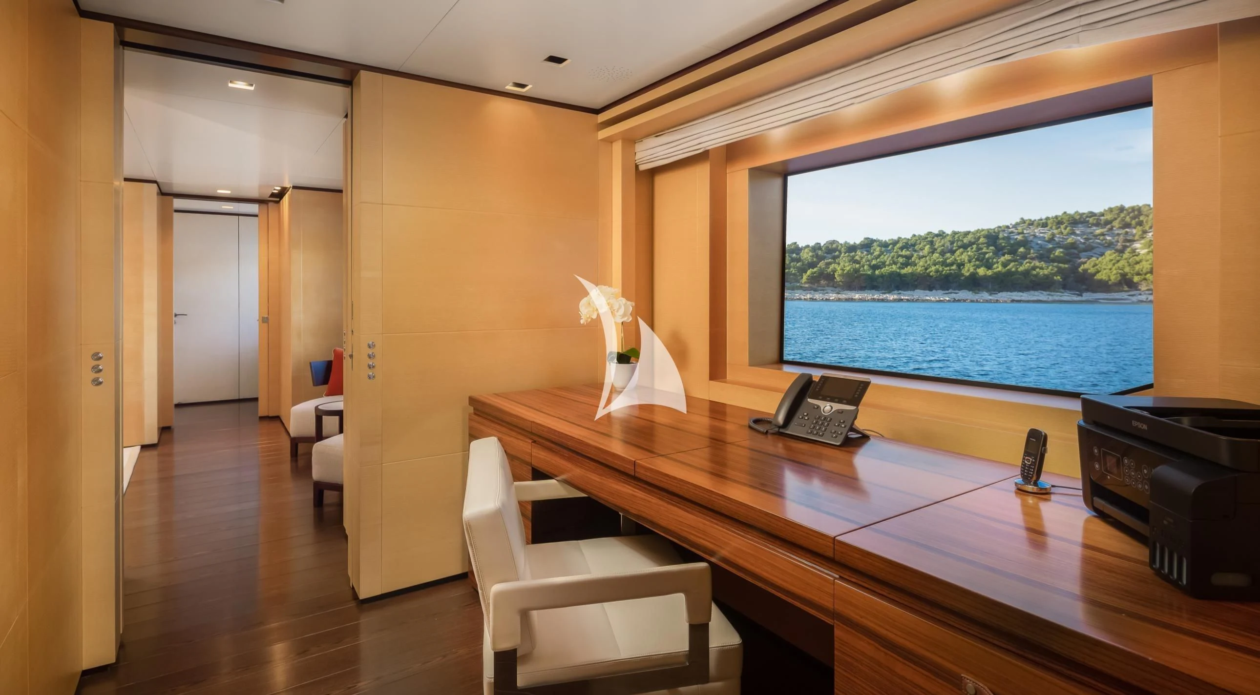 a room with a desk and a phone on the table aboard LAMMOUCHE Yacht for Sale
