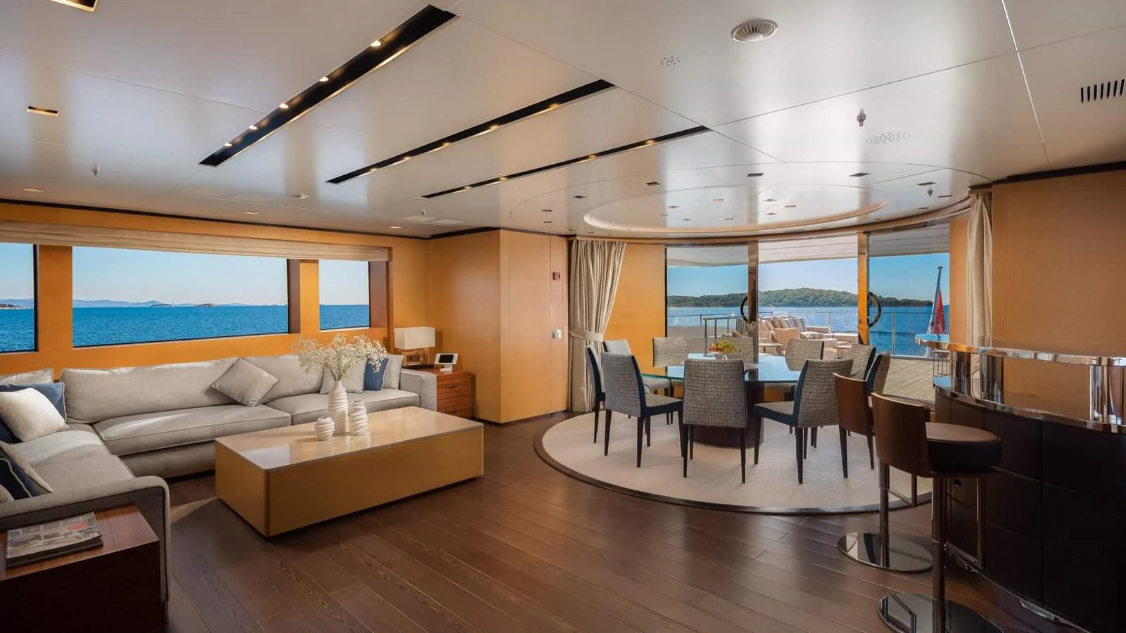 a living room with a large window aboard LAMMOUCHE Yacht for Sale