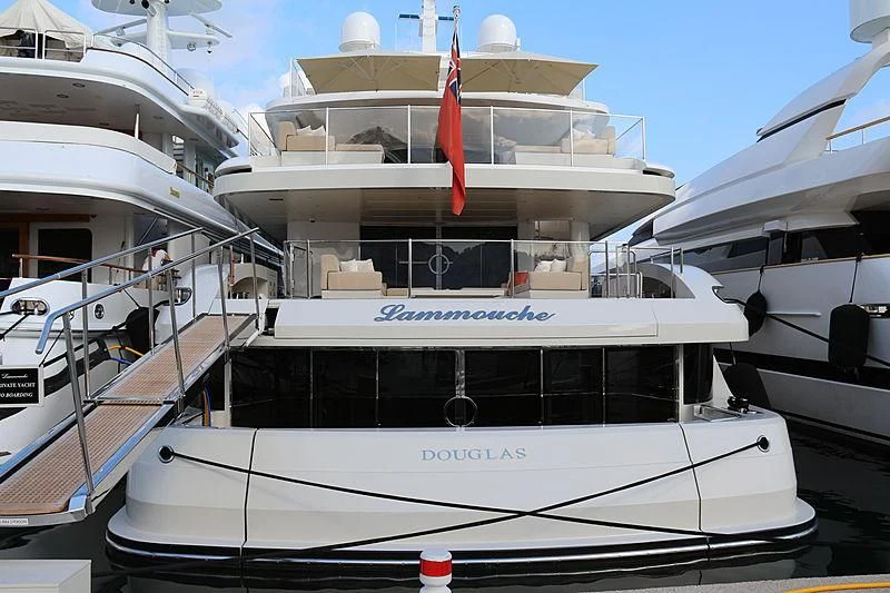 a white yacht with a red sail aboard LAMMOUCHE Yacht for Sale