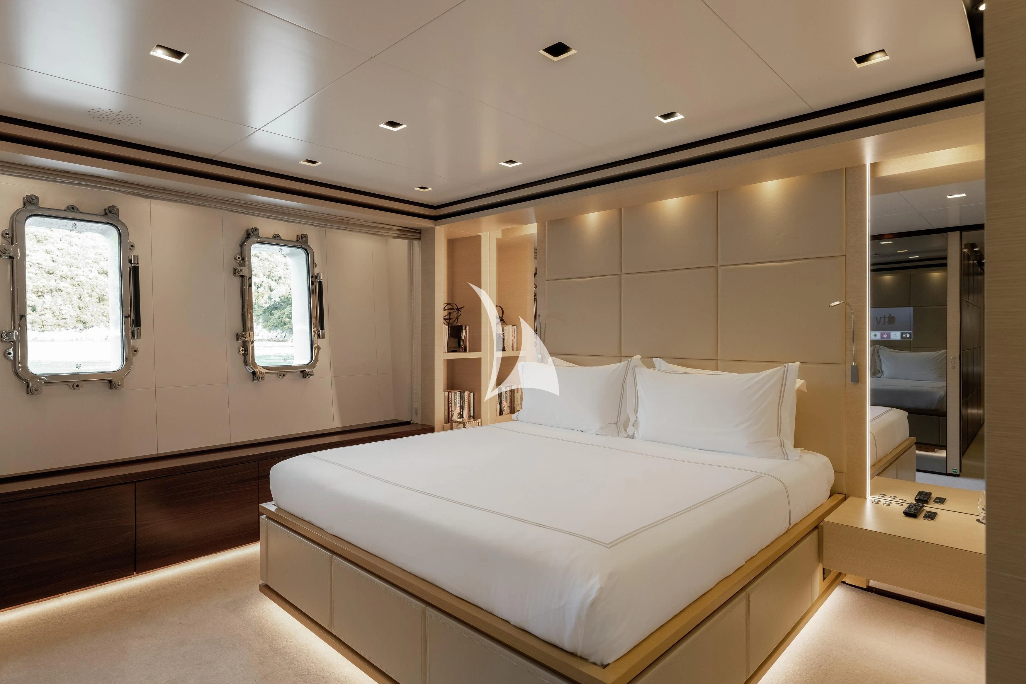 a room with a bed and a mirror aboard LAMMOUCHE Yacht for Sale
