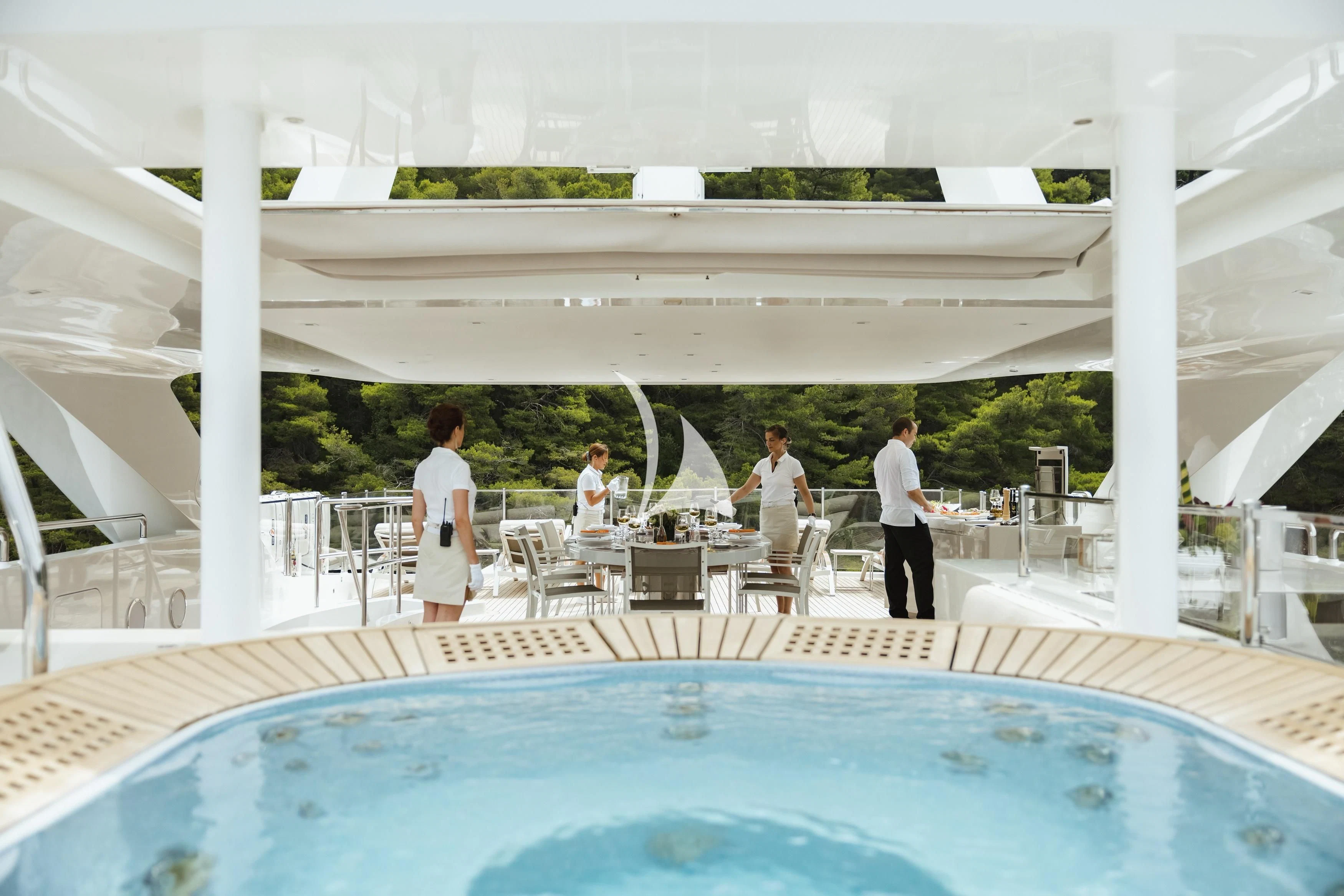 people standing around a pool aboard LAMMOUCHE Yacht for Sale