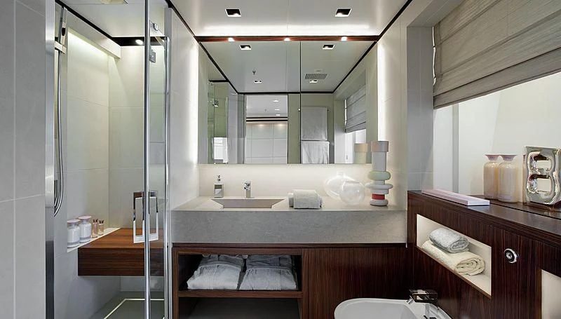 a bathroom with a large mirror aboard LAMMOUCHE Yacht for Sale