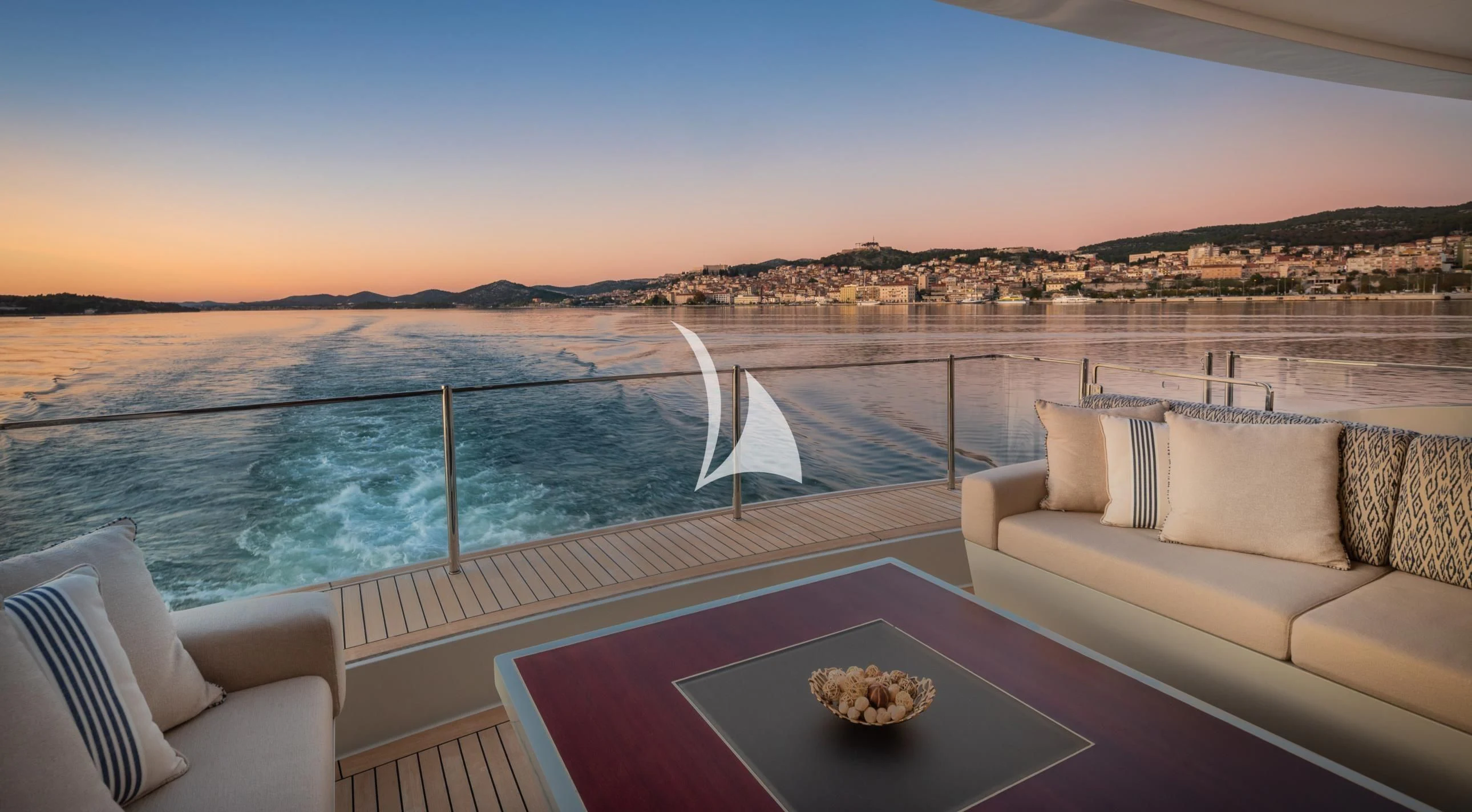 a balcony overlooking a body of water aboard LAMMOUCHE Yacht for Sale