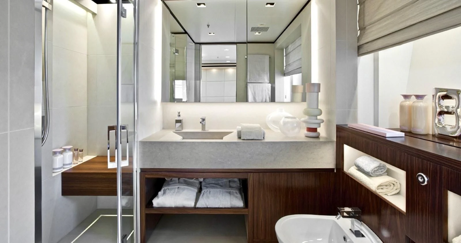 a bathroom with a sink and mirror aboard LAMMOUCHE Yacht for Sale