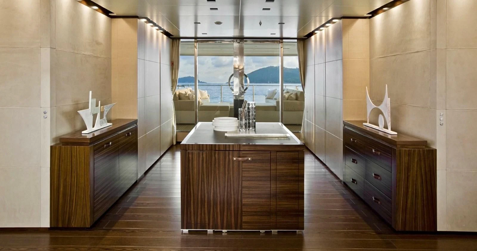 a kitchen with a countertop sink and cabinets aboard LAMMOUCHE Yacht for Sale