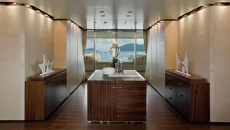 a kitchen with a countertop sink and cabinets aboard LAMMOUCHE Yacht for Sale