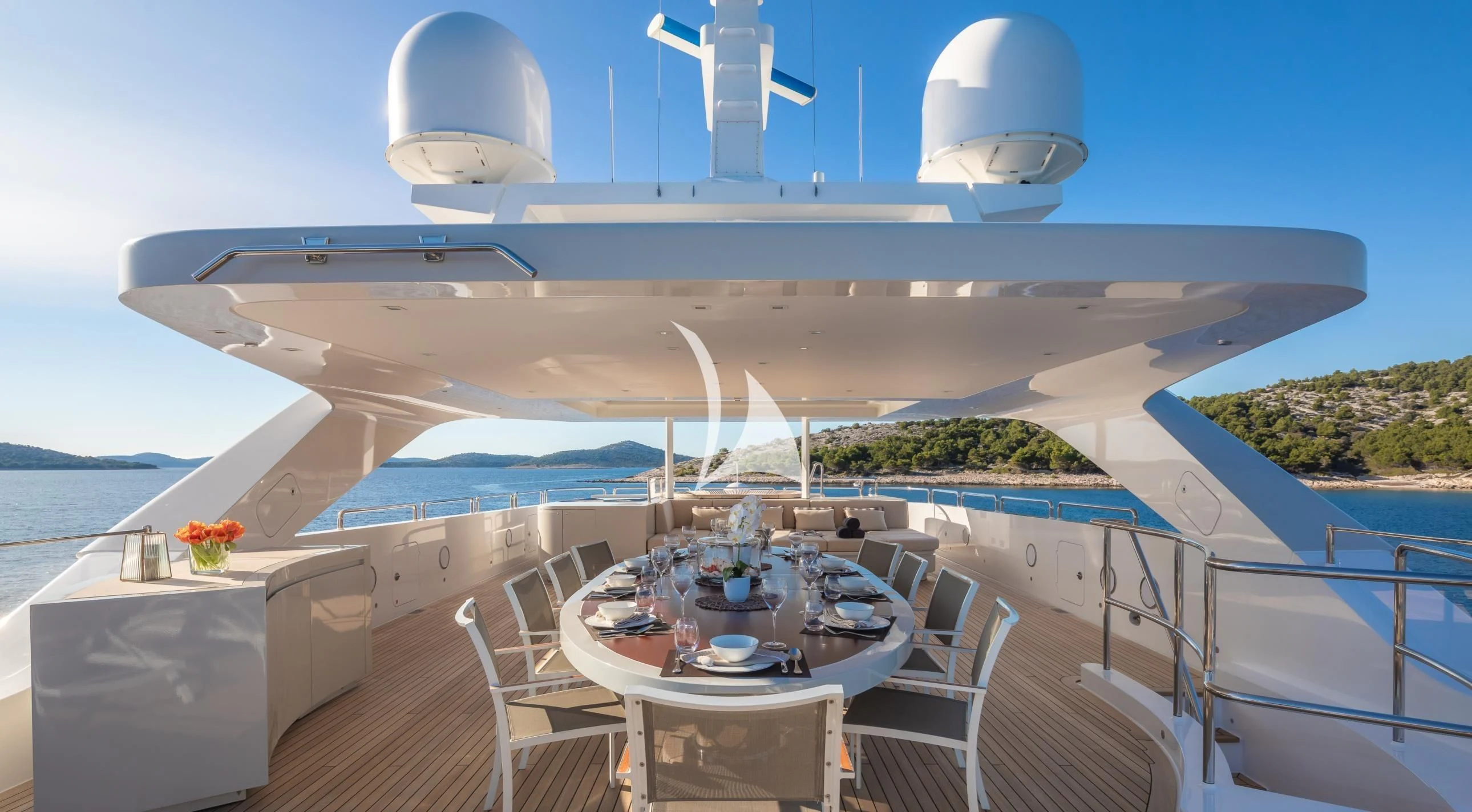 a large white ship with chairs and tables on a deck aboard LAMMOUCHE Yacht for Sale
