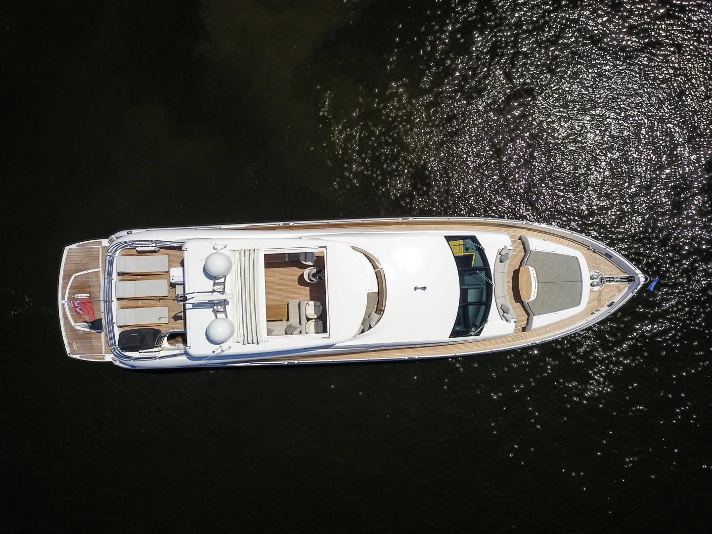 a silver and gold car with a logo on it aboard FUNSEEKER Yacht for Sale