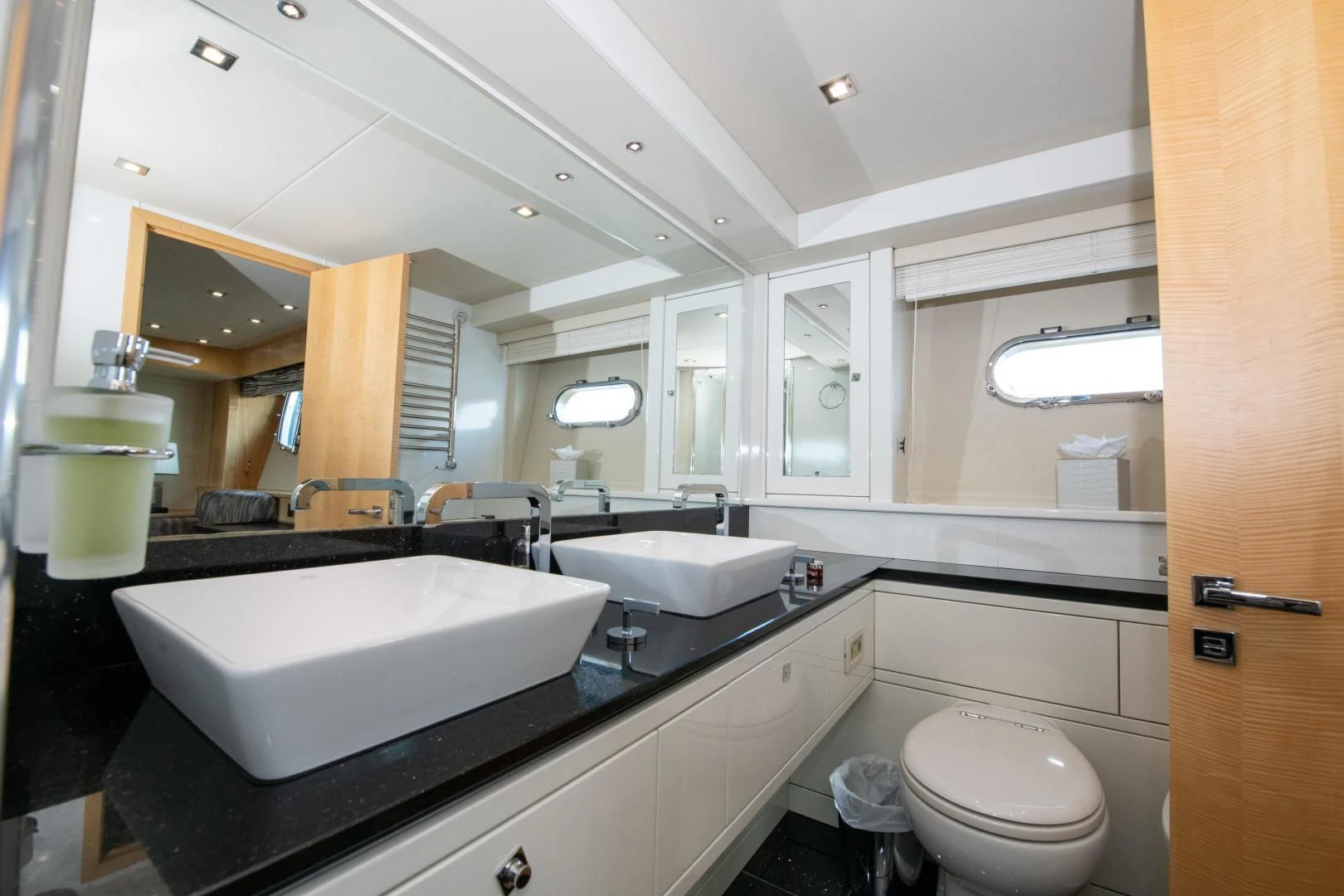 a bathroom with a large mirror aboard FUNSEEKER Yacht for Sale