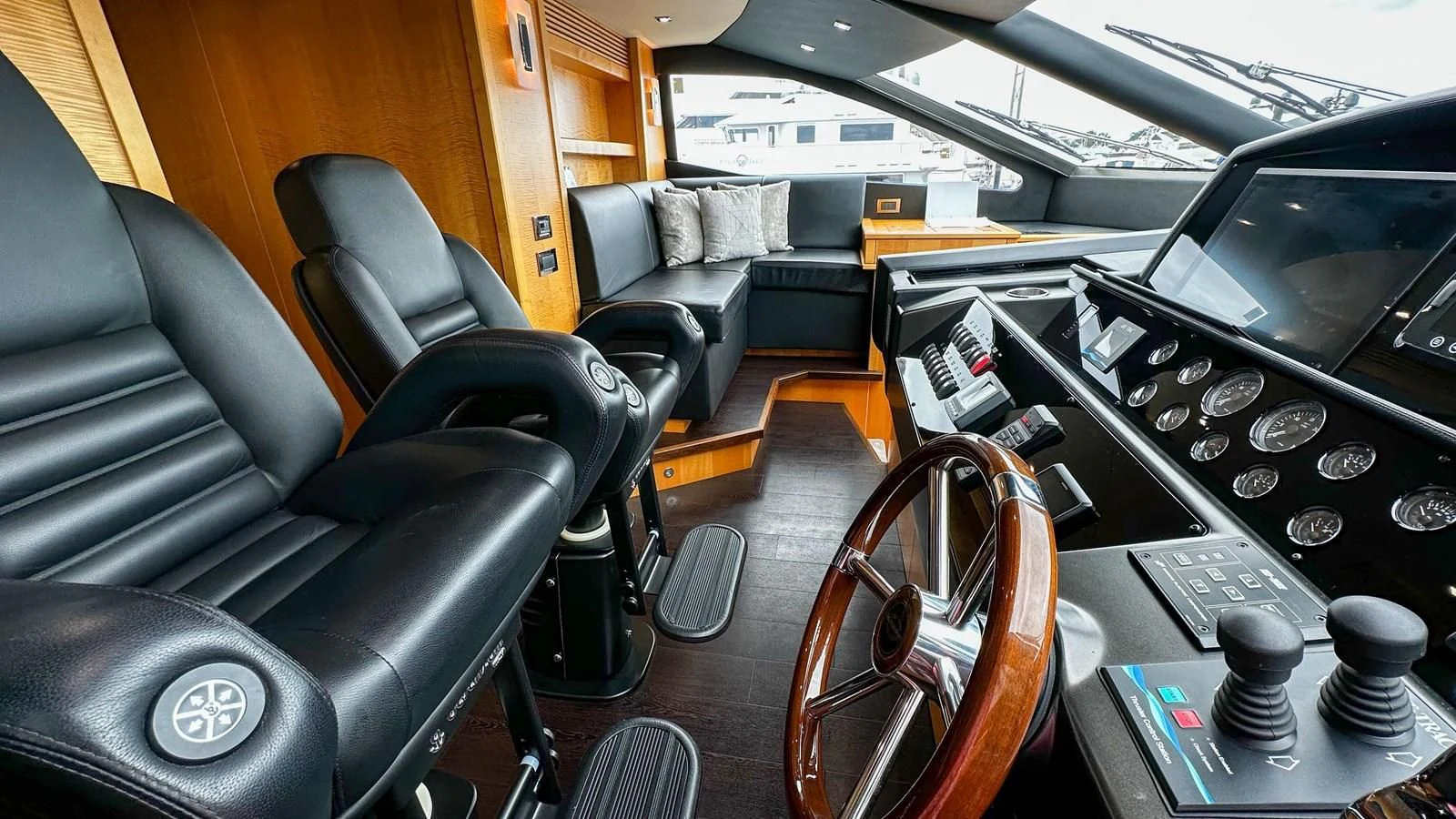 a room with a desk and chairs aboard FUNSEEKER Yacht for Sale