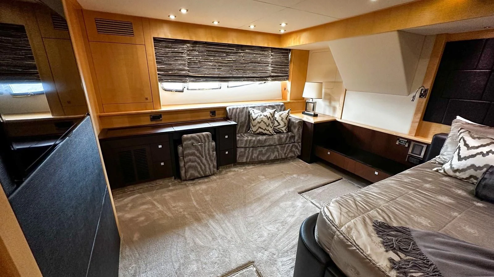 a room with a bed and a desk aboard FUNSEEKER Yacht for Sale