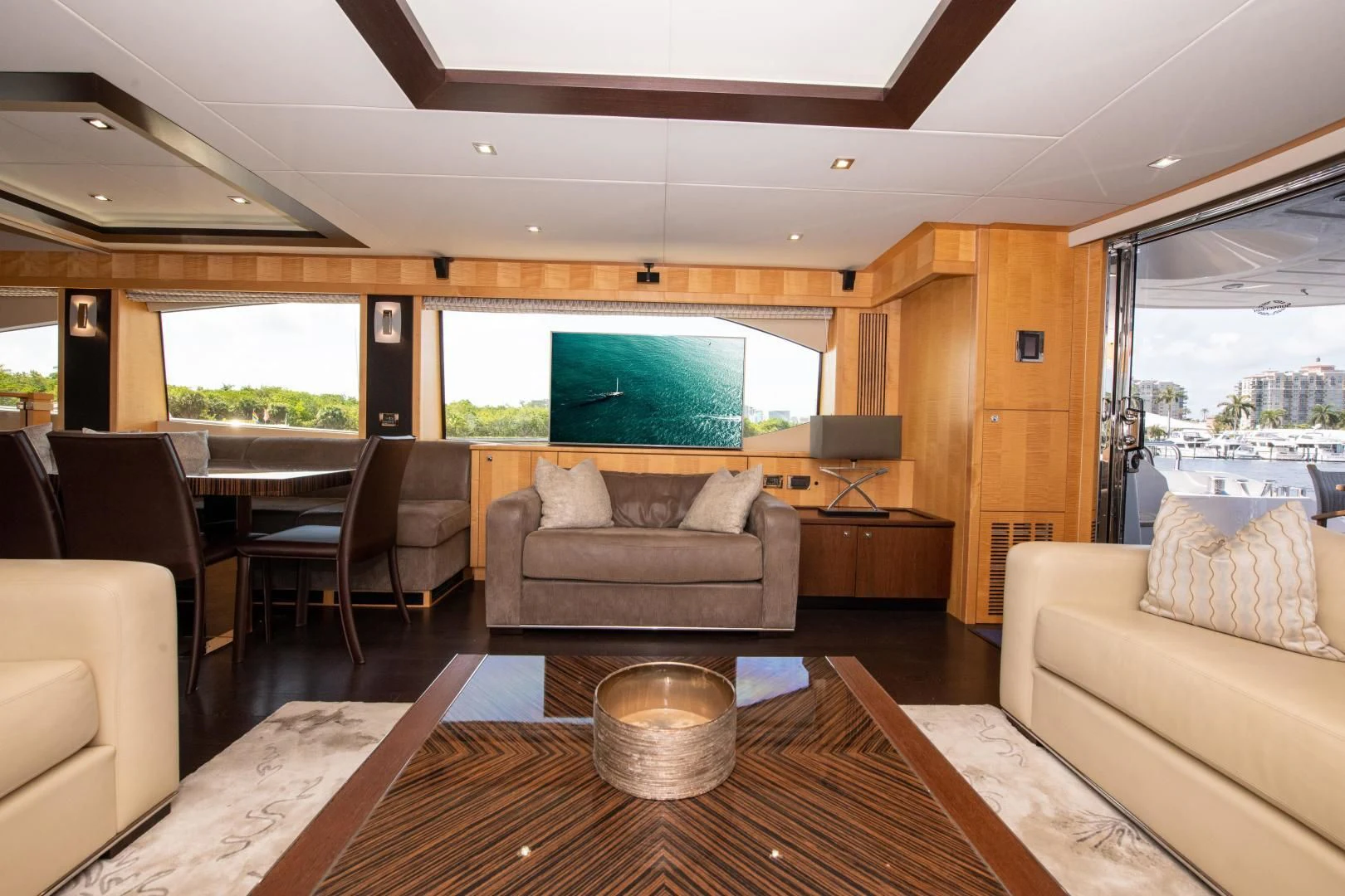 a living room with a large window aboard FUNSEEKER Yacht for Sale