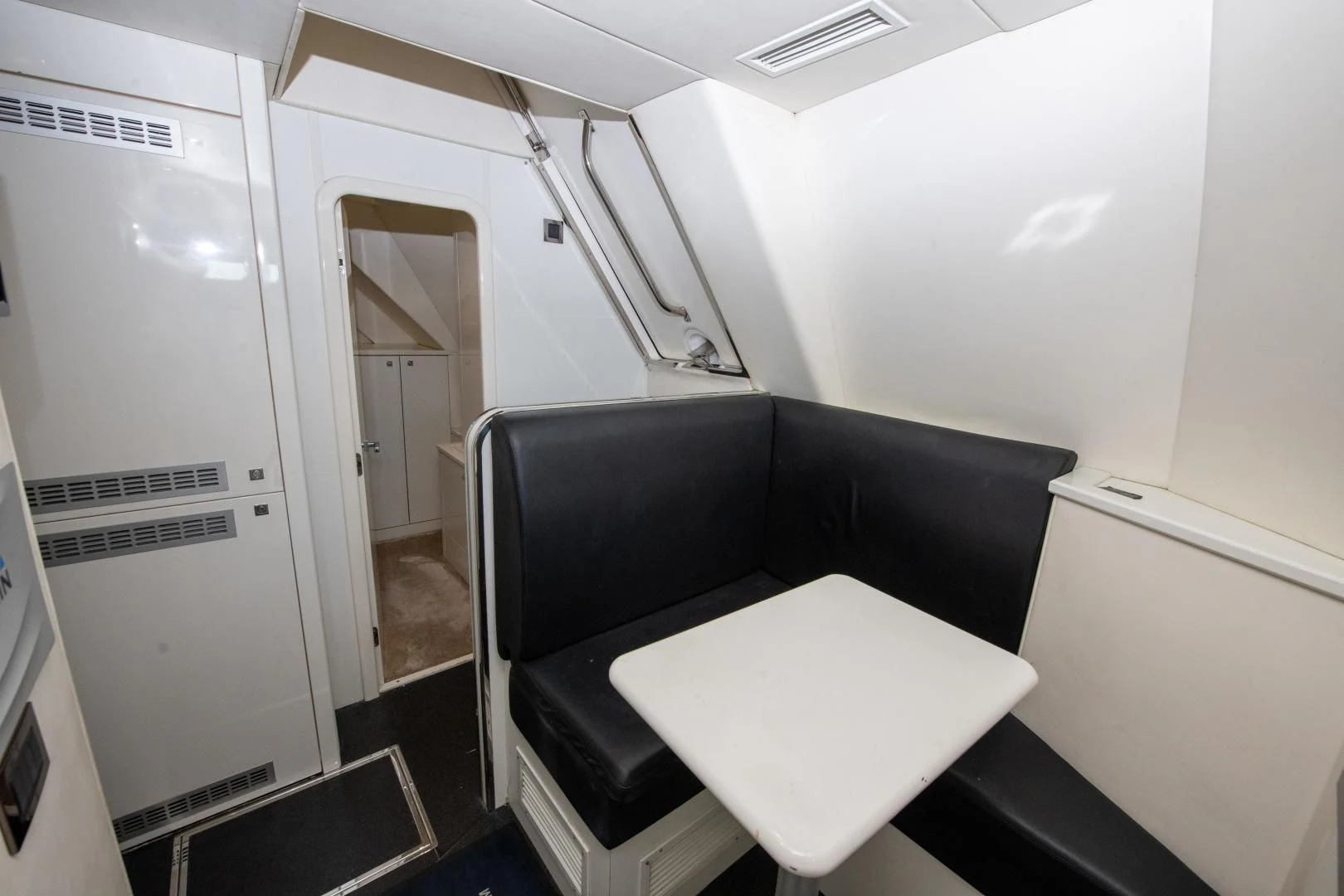 a room with a desk and a chair aboard FUNSEEKER Yacht for Sale