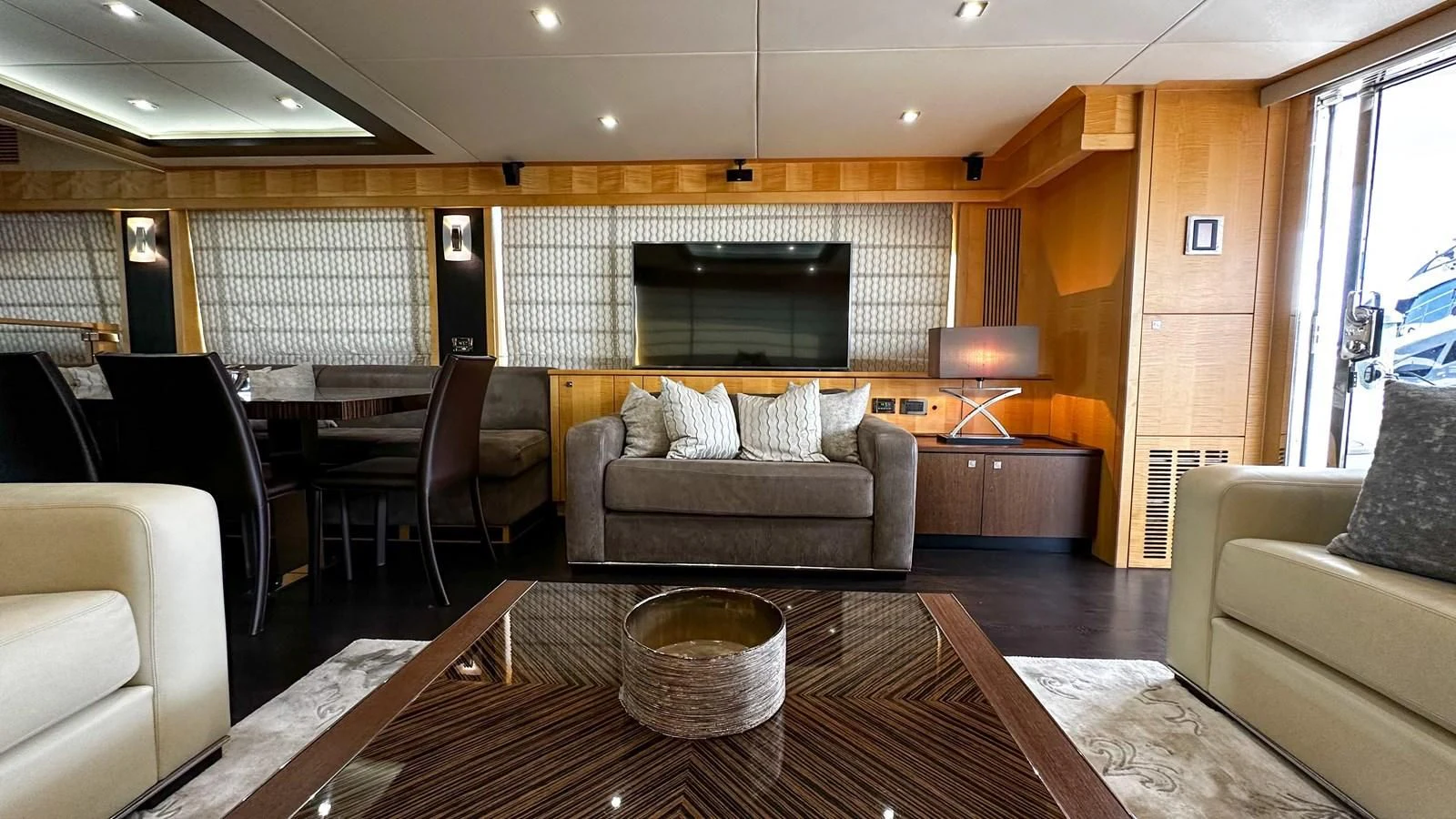 a living room with a couch and a television aboard FUNSEEKER Yacht for Sale