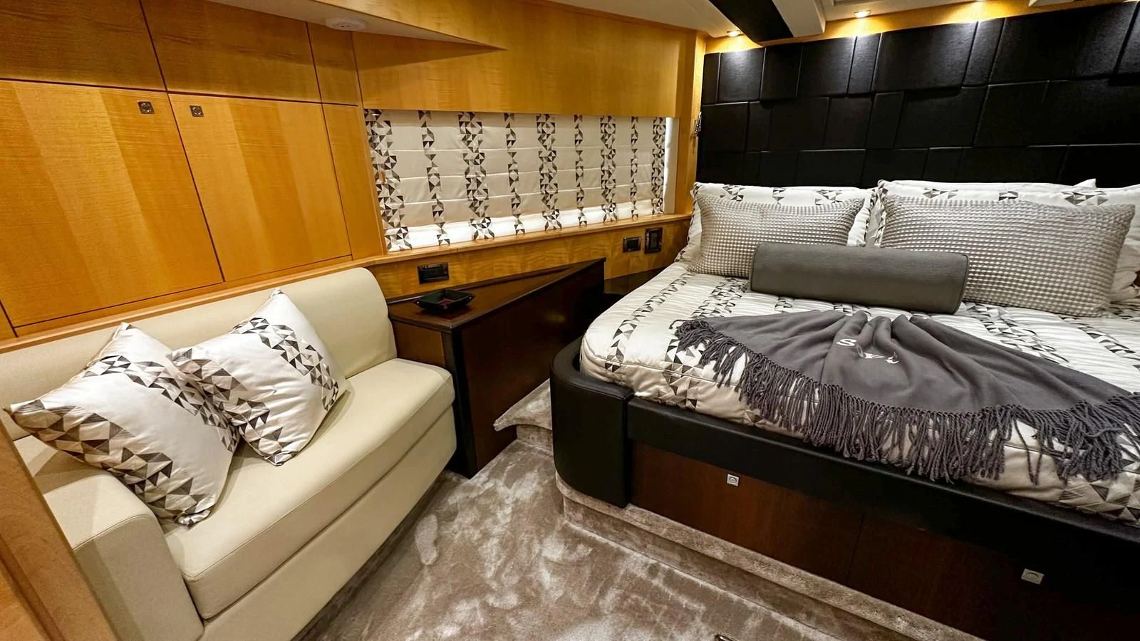 a room with a bed and a couch aboard FUNSEEKER Yacht for Sale