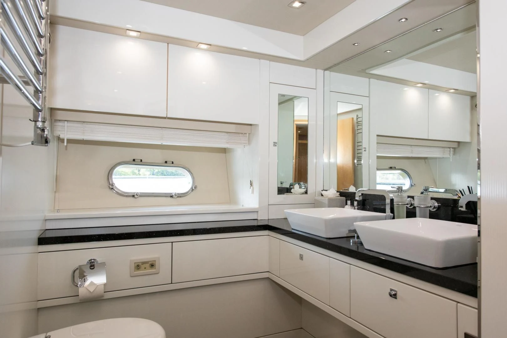 a bathroom with white cabinets aboard FUNSEEKER Yacht for Sale