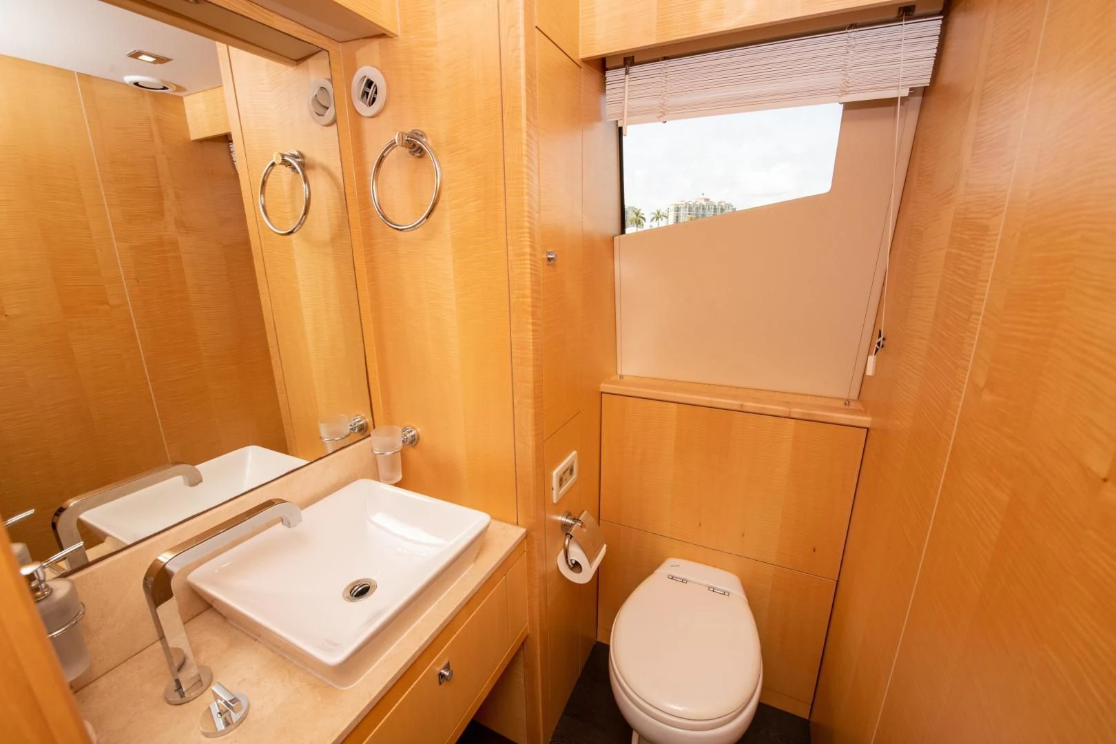 a bathroom with a toilet and sink aboard FUNSEEKER Yacht for Sale
