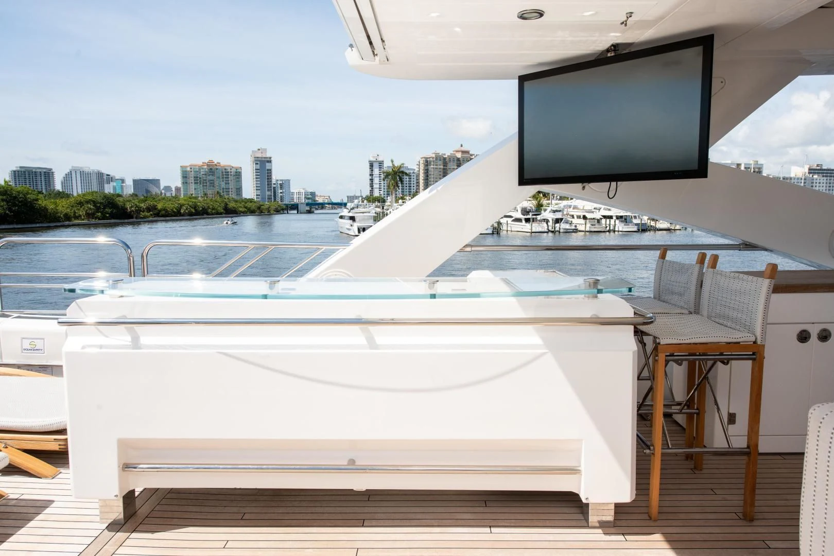 a large white boat with a tv on the roof aboard FUNSEEKER Yacht for Sale
