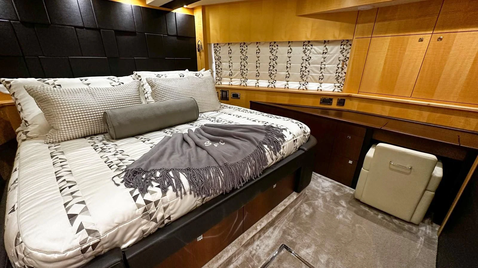 a room with a bed and a box aboard FUNSEEKER Yacht for Sale