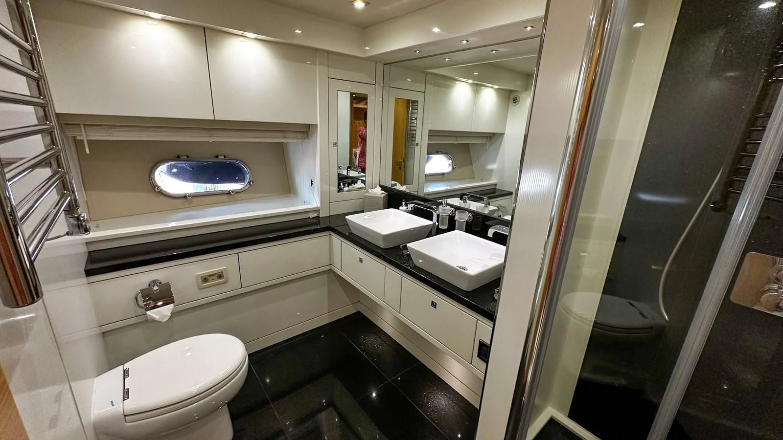 a bathroom with a glass shower aboard FUNSEEKER Yacht for Sale