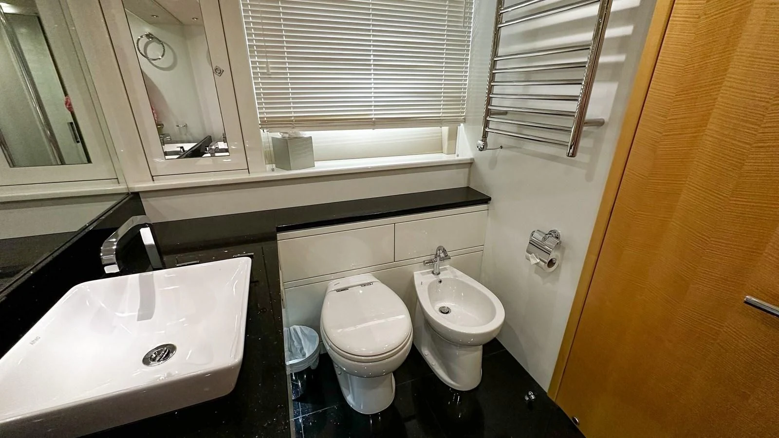a bathroom with a sink toilet and a bathtub aboard FUNSEEKER Yacht for Sale