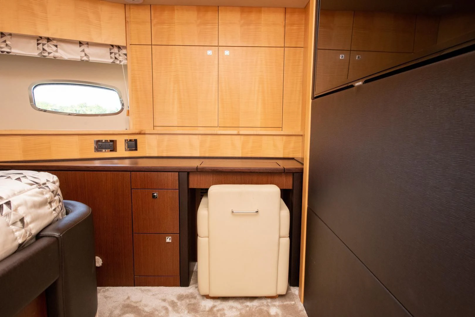 a room with wooden cabinets aboard FUNSEEKER Yacht for Sale