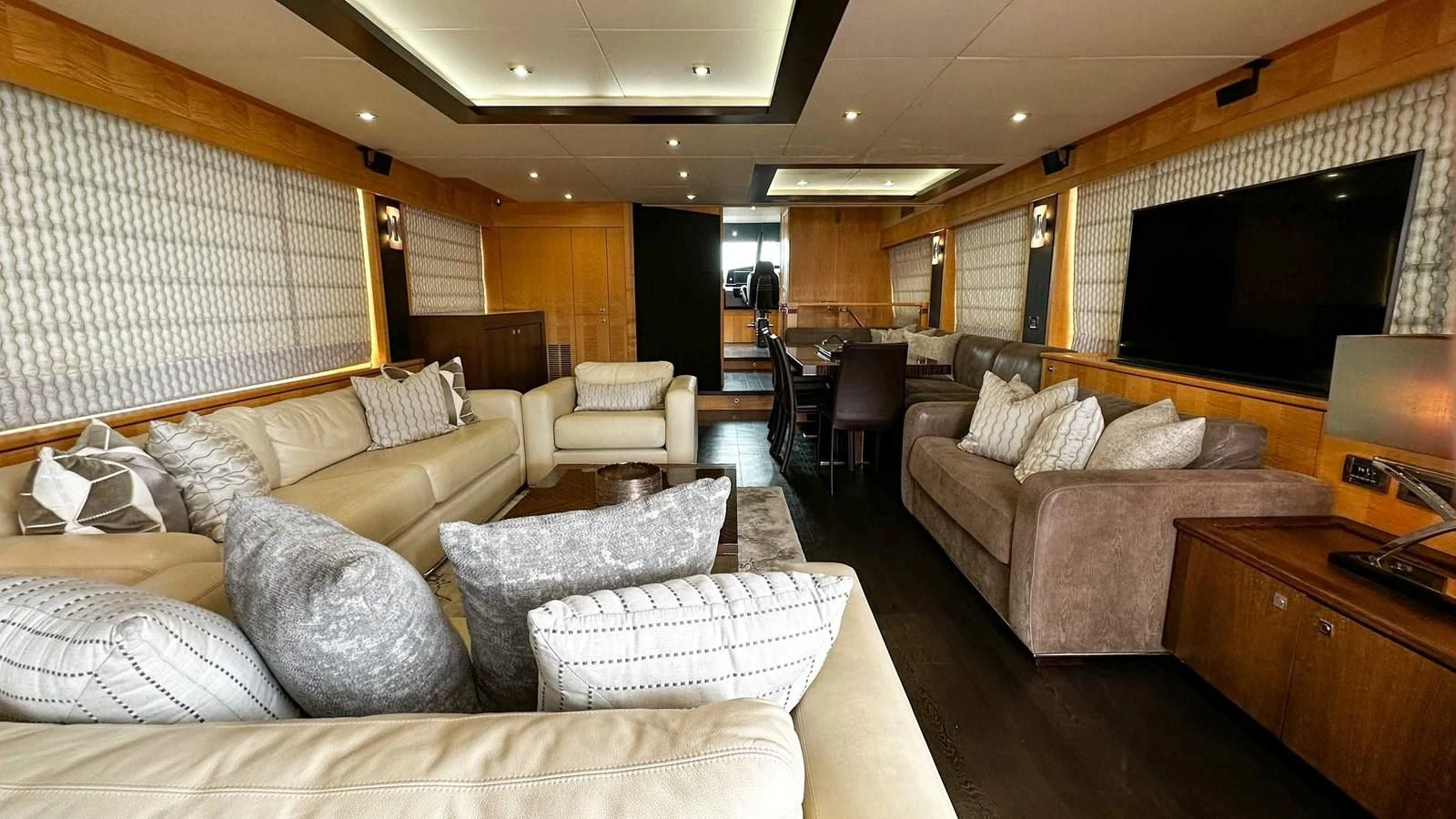a living room with a couch and a tv aboard FUNSEEKER Yacht for Sale