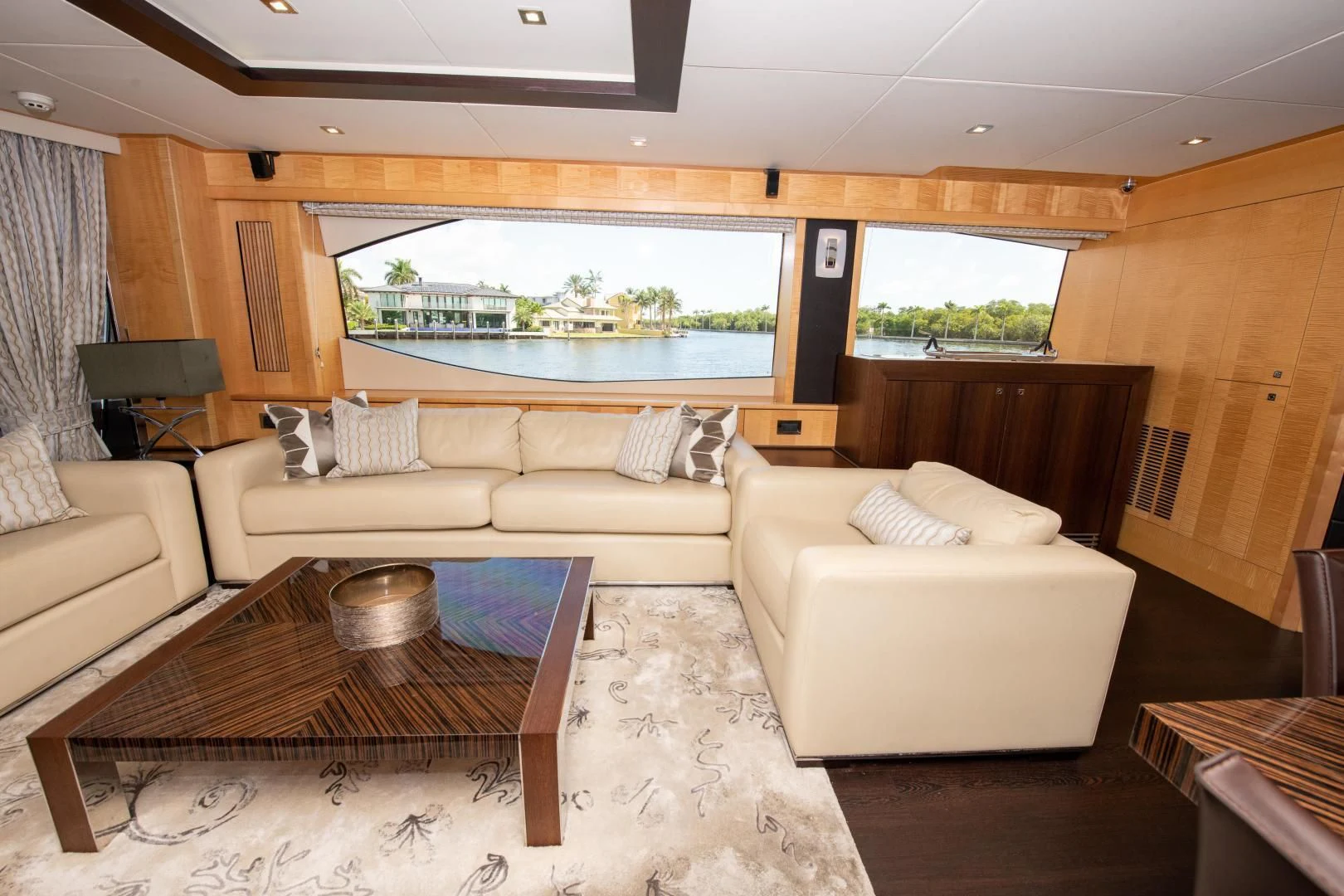 a living room with a large window aboard FUNSEEKER Yacht for Sale