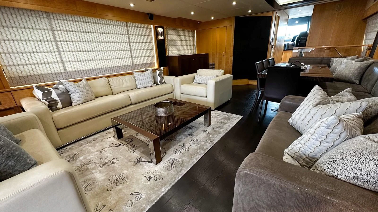 a living room with a couch and a coffee table aboard FUNSEEKER Yacht for Sale