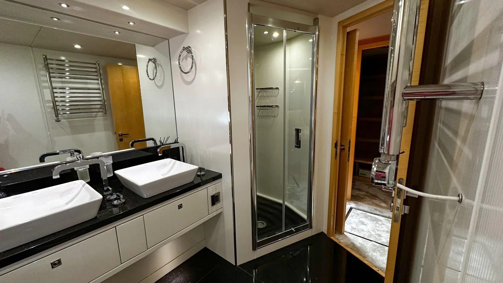a bathroom with sinks and mirrors aboard FUNSEEKER Yacht for Sale