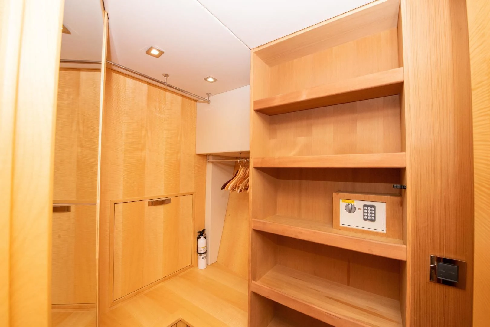 a room with wooden cabinets aboard FUNSEEKER Yacht for Sale