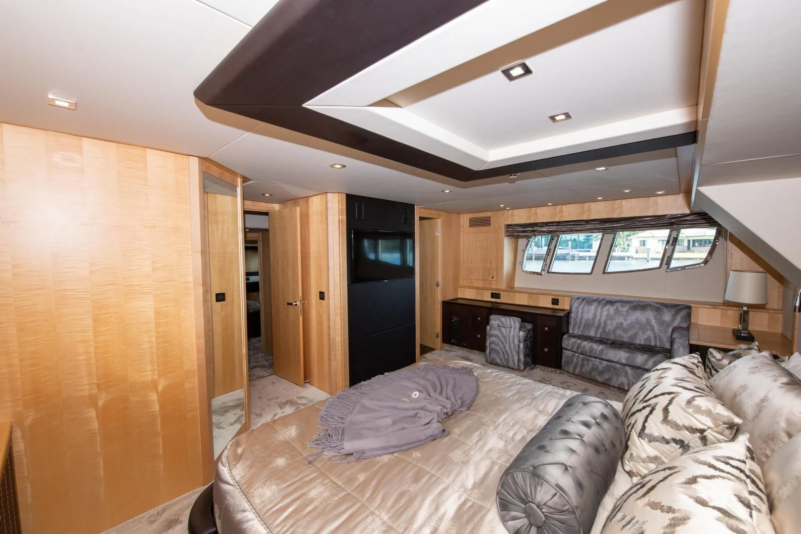 a living room with a large bed aboard FUNSEEKER Yacht for Sale